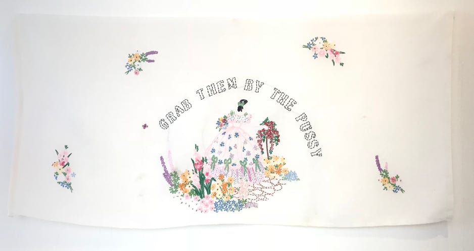 Corinne Greenhalgh Grab them by the pussy 2018 Embroidered text on found linen 